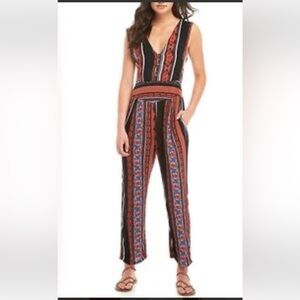 Free People Vibrant Striped Jumpsuit - some light wear on the back